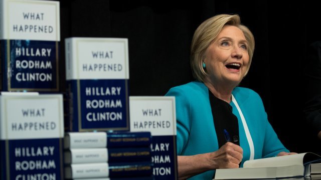 Hillary Clinton with copies of her book, "What Happened."