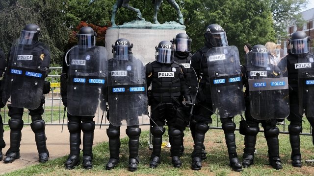 Virginia State Police stand in riot gear in Charlottesville, Virginia.
