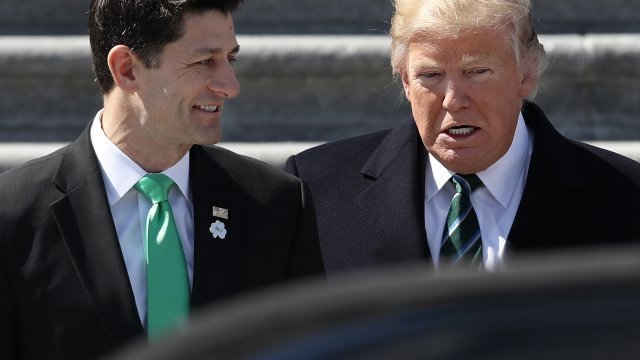 President Donald Trump talks with Speaker of the House Paul Ryan