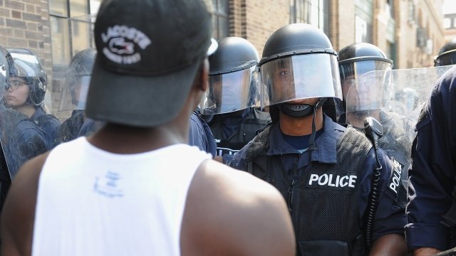A protester and a police officer stare each other down in St. Louis, Missouri.