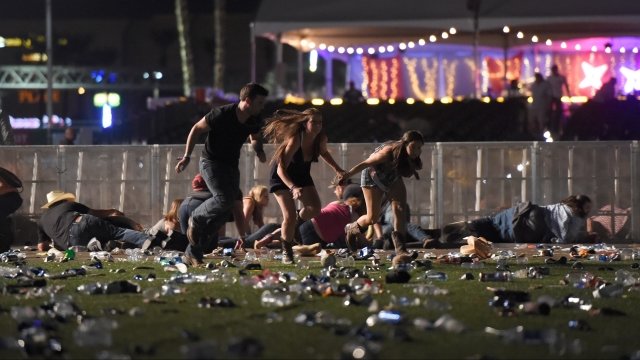 People run from the Route 91 Harvest country music festival after gunfire was heard.