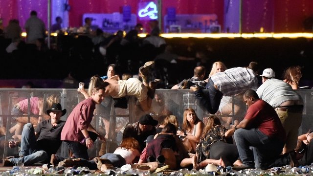 People run from gunfire at a country music concert in Las Vegas, Nevada on Monday.
