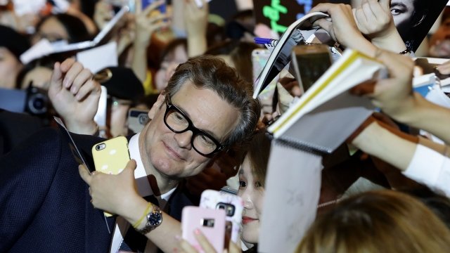 Actor Colin Firth from "Kingsman" with fans in South Korea.