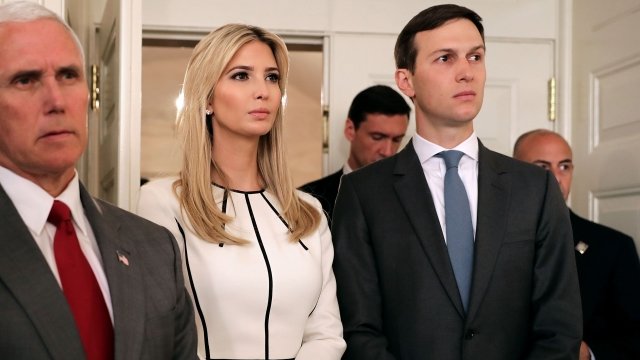 Ivanka Trump and Jared Kushner stand behind Vice President Mike Pence