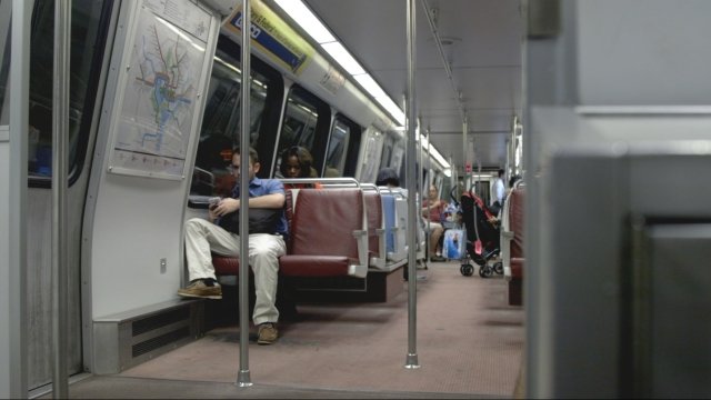 People ride the Washington, D.C., metro on a weekday