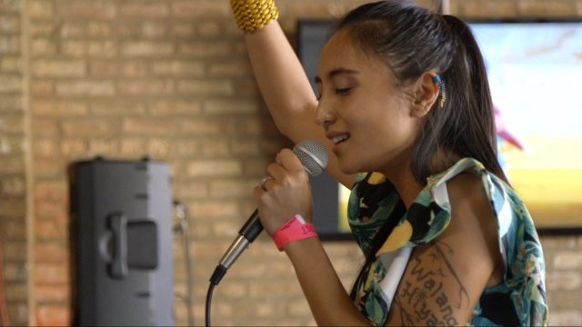 Undocumented singer Stephanie "Soultree" Camba entertains a crowd in Chicago.