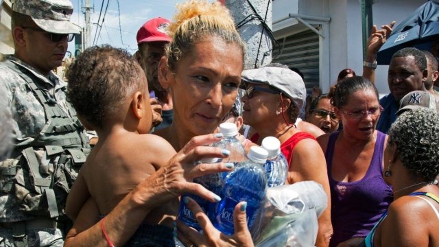 Woman receives help from FEMA.