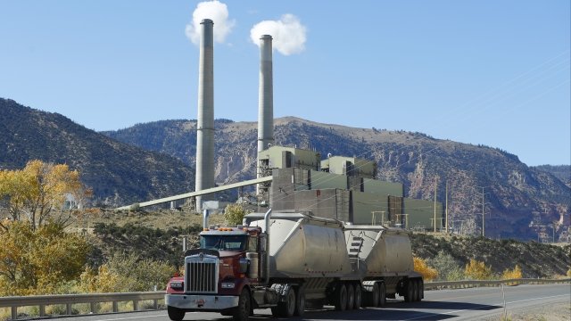 A truck drives by Pacificorp's coal-fired power plant