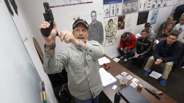 Gun instructor Mike Stilwell teaches a concealed-carry permit class in Utah