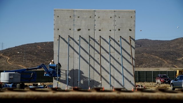 Construction on a border wall prototype.