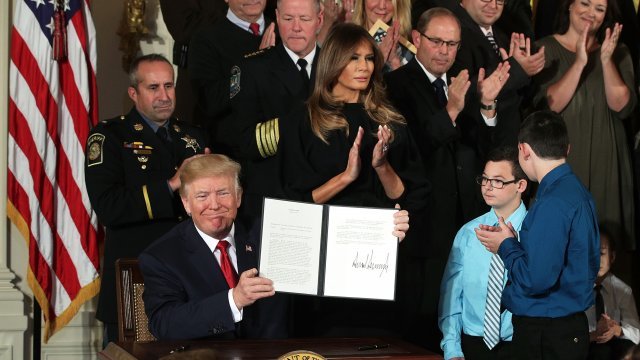 U.S. President Donald Trump shows presidential memorandum that he signed