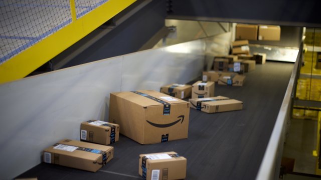 Boxes move down a conveyer belt atthe Amazon Fulfillment Center in New Jersey