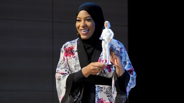Ibtihaj Muhammad with hijab-wearing Barbie