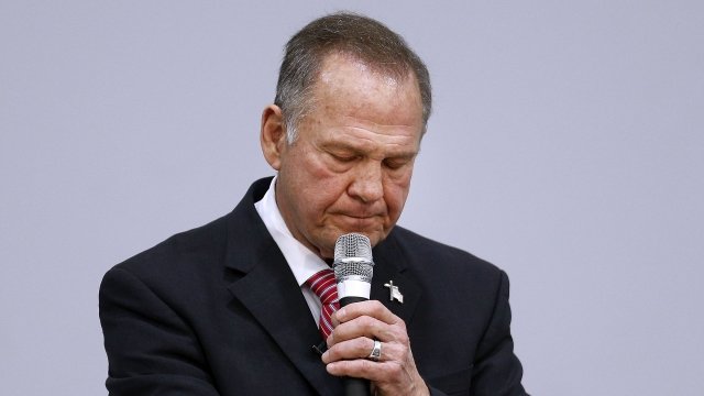 Roy Moore speaks into a microphone