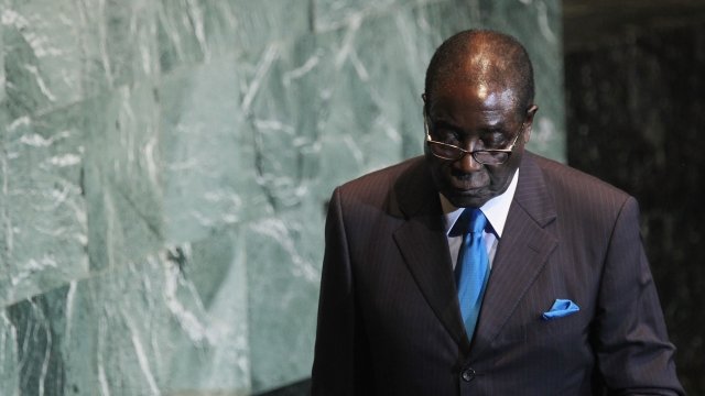 Robert Mugabe walks after delivering an address to the United Nations General Assembly.