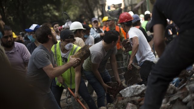 Rescuers work to move rubble from a magnitude 7.1 earthquake that hit Mexico City on Sept. 19, 2017