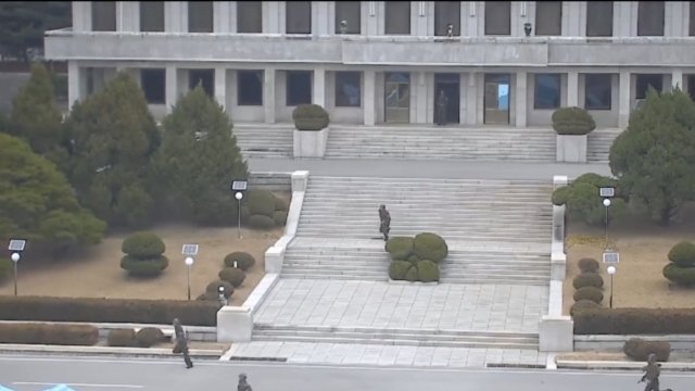 North Korean soldiers chasing after a defector.