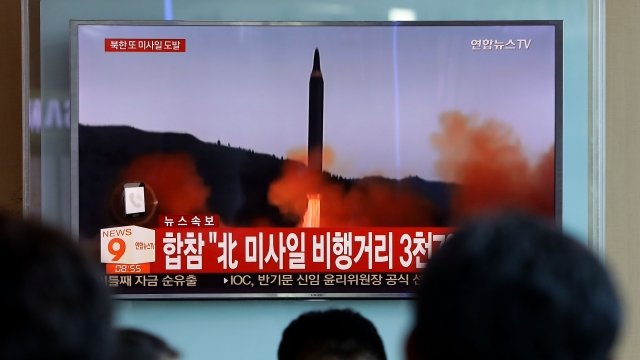 People watch news of North Korea's September missile launch
