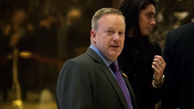 Republican National Committee communications director Sean Spicer walks through the lobby at Trump Tower, December 14, 2016 i