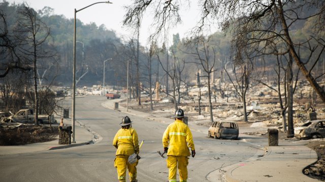 Firefighters walk through the Fountaingrove neighborhood in Sonoma County, California