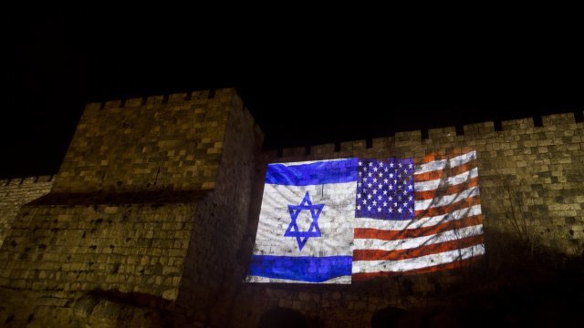 US and Israeli national flags projected on the wall of Jerusalem's Old City on December 6, 2017 in Jerusalem, Israel.