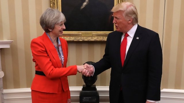 British Prime Minister Theresa May shakes hands with U.S. President Donald Trump.