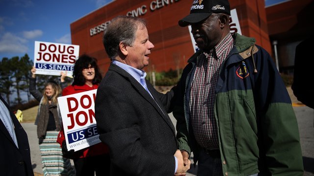 Doug Jones shakes voter's hand