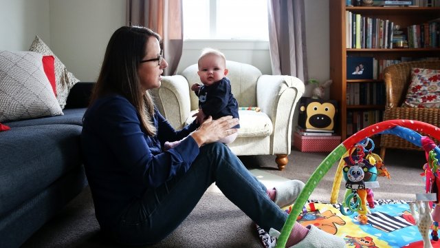 Teacher Sarah Ward at home on maternity leave with her 3-month-old daughter