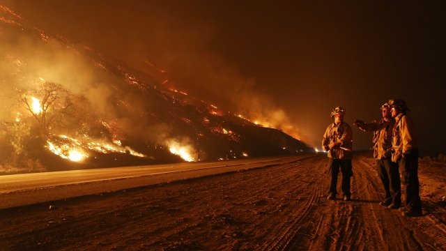 Firefighters monitor a section of the Thomas Fire