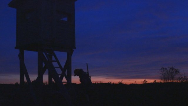 A hunter leaves her stand in Virginia after a day of hunting.