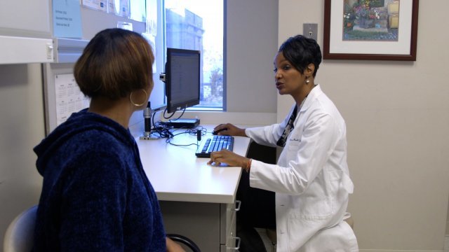 Dr. Monica Peek chats with a patient
