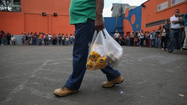 man walking with bags of food