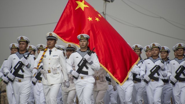 Chinese service members participate in a military parade in Djibouti City.