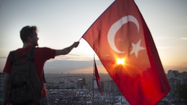 Person waves the flag of Turkey