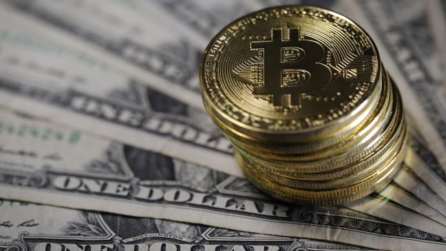 A visual representation of bitcoins alongside US dollars