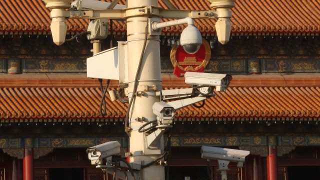 Security cameras on a pole outside of Tiananmen Square
