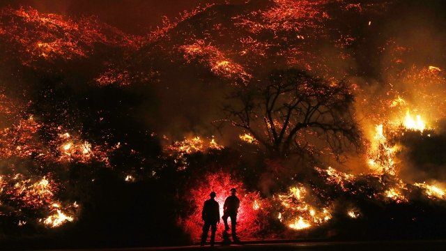 Firefighters watch the Thomas fire in Southern California