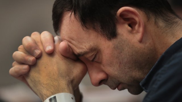 Larry Nassar listens to victim impact statements prior to being sentenced.