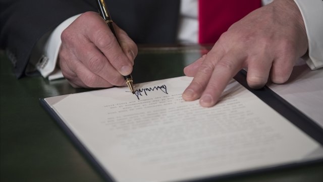 President Donald Trump signs a bill