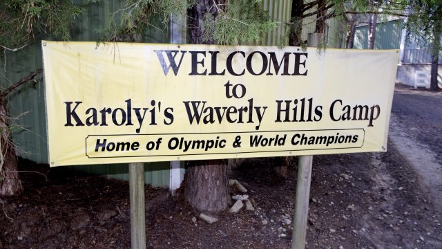 Sign welcoming visitors to Karolyi Ranch
