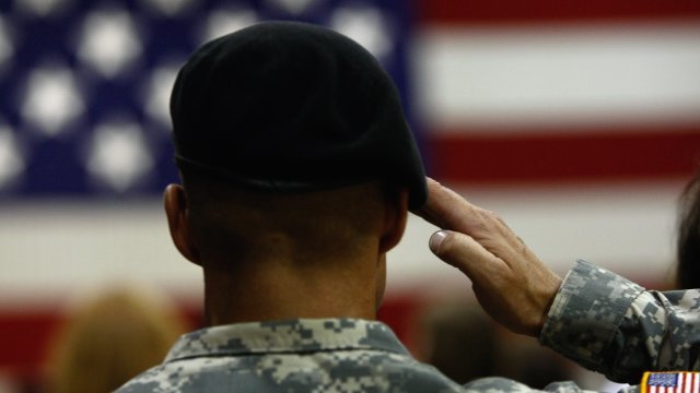 A U.S. Army soldier salutes during the National Anthem.