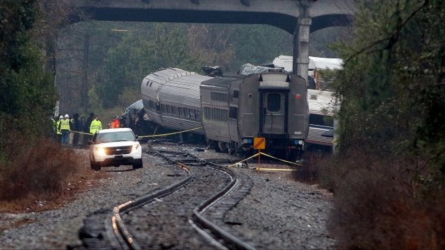Investigators examine wreckage of the February 4, 2018 Amtrak train crash in Cayce, S.C.