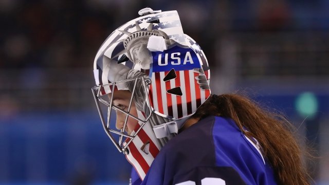 U.S. women's hockey player in a goalie mask