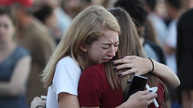 Florida school shooting mourners at a vigil for the victims of the Stoneman Douglas High School shooting