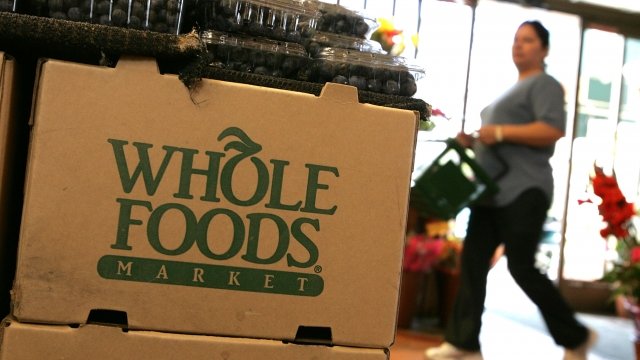 The Whole Foods logo adorns a cardboard box at a Whole Foods Market.