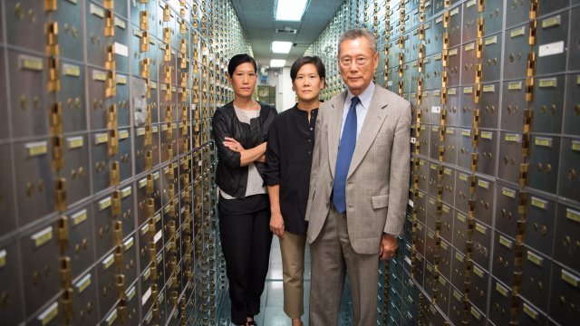 The Sung family, owners of Abacus Federal Savings Bank and subjects of a documentary, are photographed in the bank's vault.