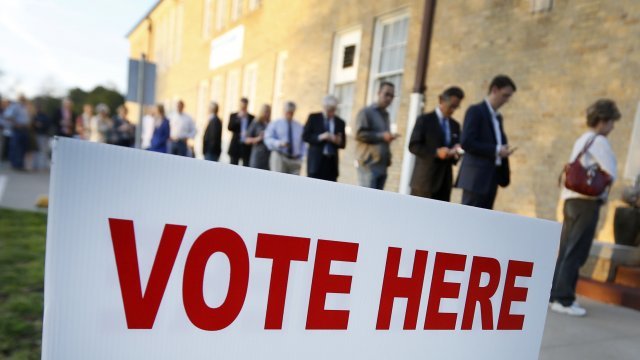 Voters line up outside polling place