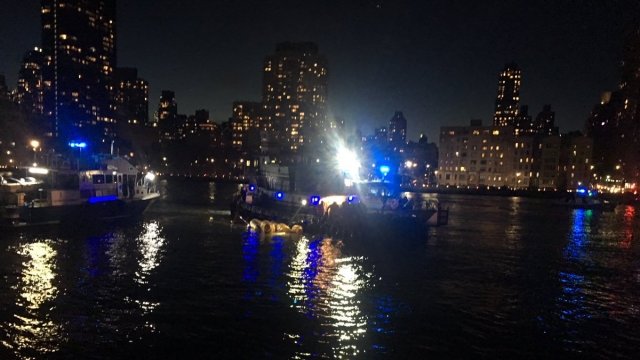 Rescue scene after helicopter crashed in East River