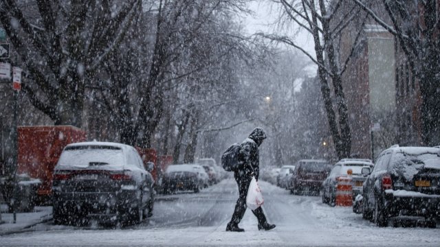 A man walks through the Boerum Hill neighborhood in Brooklyn during a snowstorm.