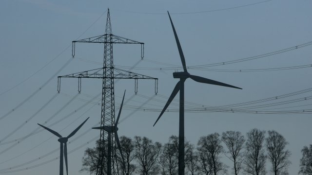 Power lines and wind turbines generating electricity